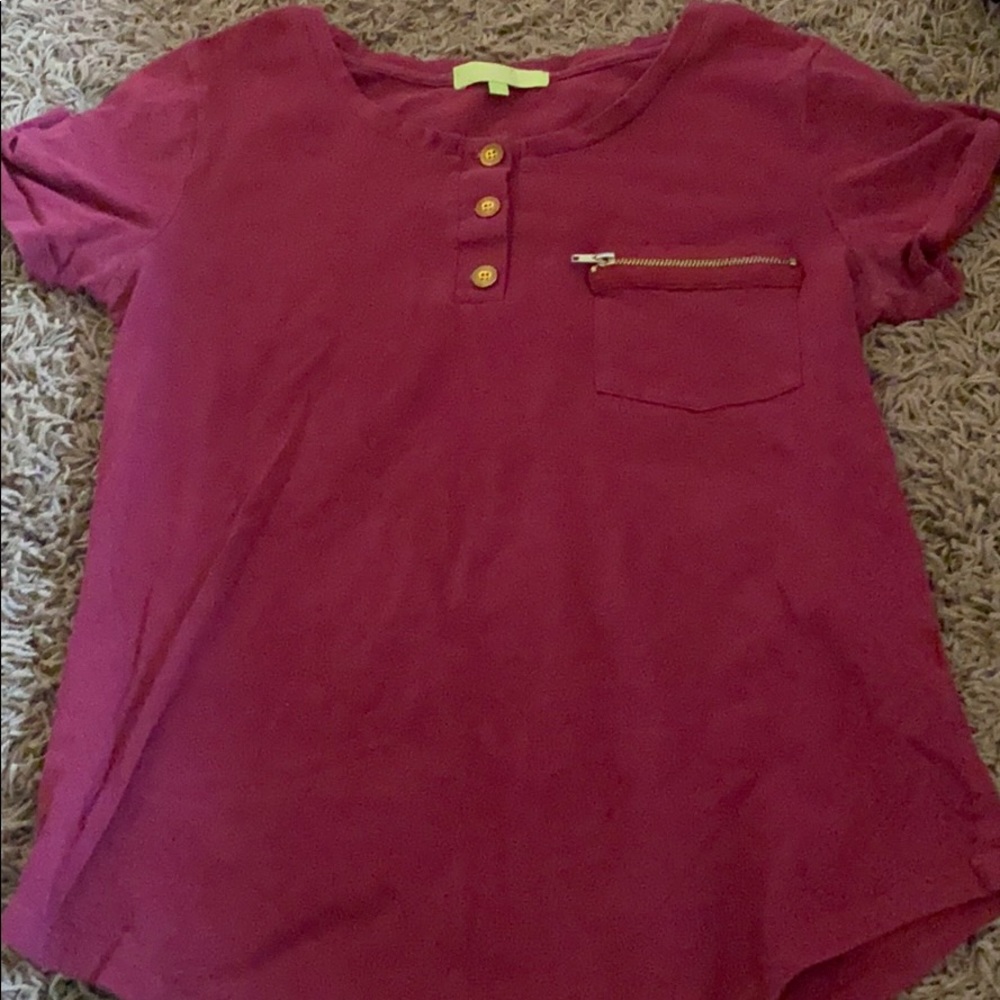 A maroon tee